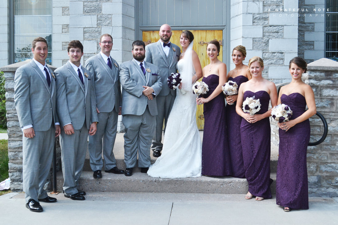Wedding Photography with Bride, Groom and Bridal Party in front of a church, located in Ontario, Canada.