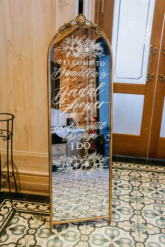 Custom Calligraphy Extra-Large Welcome Sign on Full Length Gold Framed Mirror for Bridal Shower. Photo by Rosetta Li Weddings