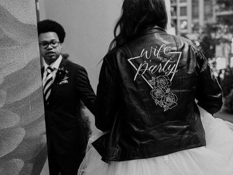 Bridal leather jacket with white modern calligraphy, read 