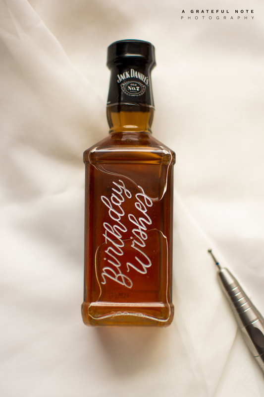 Jack Daniel's Whiskey Mickey Bottle Hand Lettered Engraving with quote "Birthday Wishes"; filled with silver Rub n' Buff.